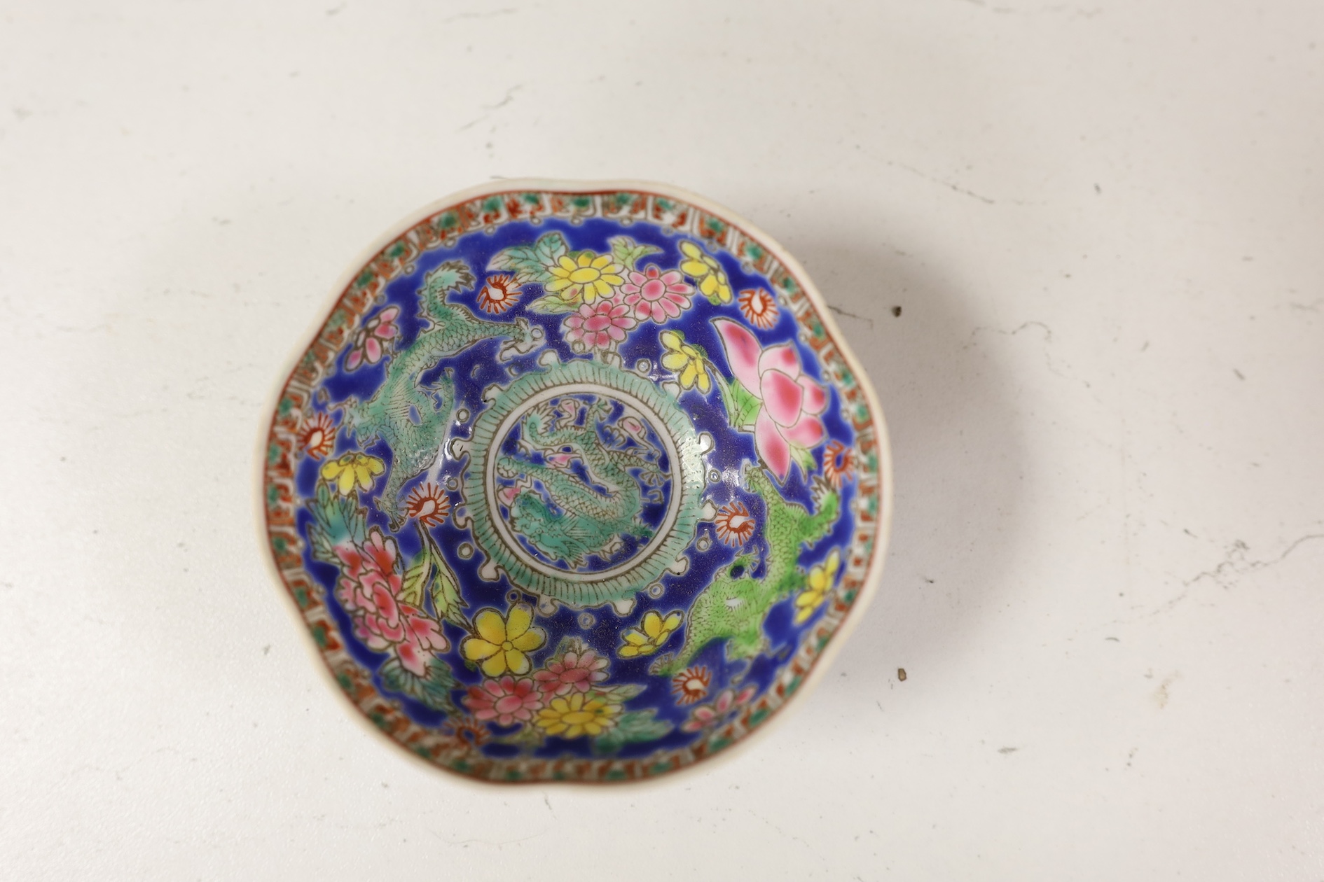 A pair of Chinese enamelled porcelain bowls, an eggshell bowl and a blue and white dragon bowl, turquoise bowls 11cm diameter (4). Condition - fair